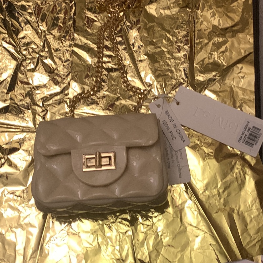 I’m selling cute mini bags and I’m doing holiday specials so it’s half off. - Picture 2 of 2